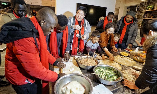 Foreigners participate in cultural event to greet Chinese New Year in Beijing