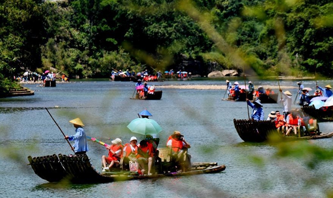 Tourists enjoy themselves in Wuyishan scenic spot in China's Fujian