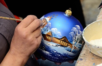 People make Christmas tree decorations at "Ariel" factory in Russia