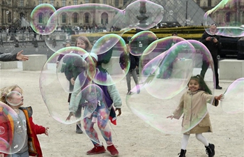 People enjoy leisure time in Paris